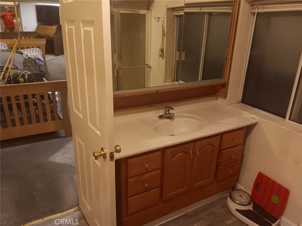 10001 West Frontage Road, Unit 64 South Gate, CA 90280 - Photo 16 of 35 a bathroom with a sink and a mirror