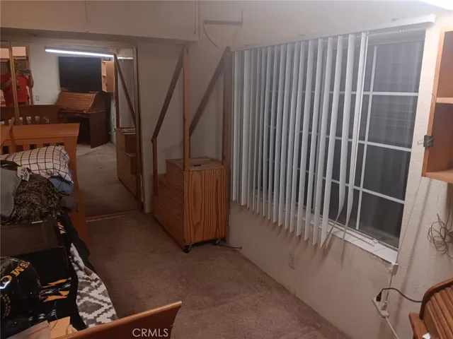 a view of a hallway with stairs