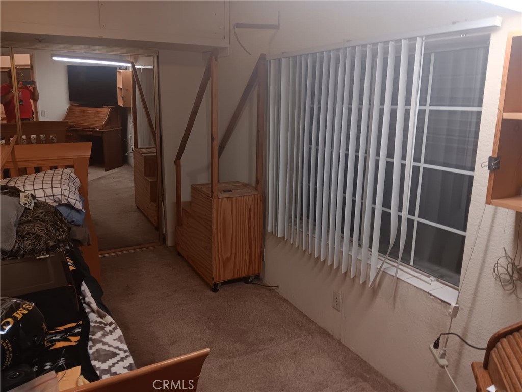 10001 West Frontage Road, Unit 64 South Gate, CA 90280 - Photo 19 of 35 a view of a hallway with stairs