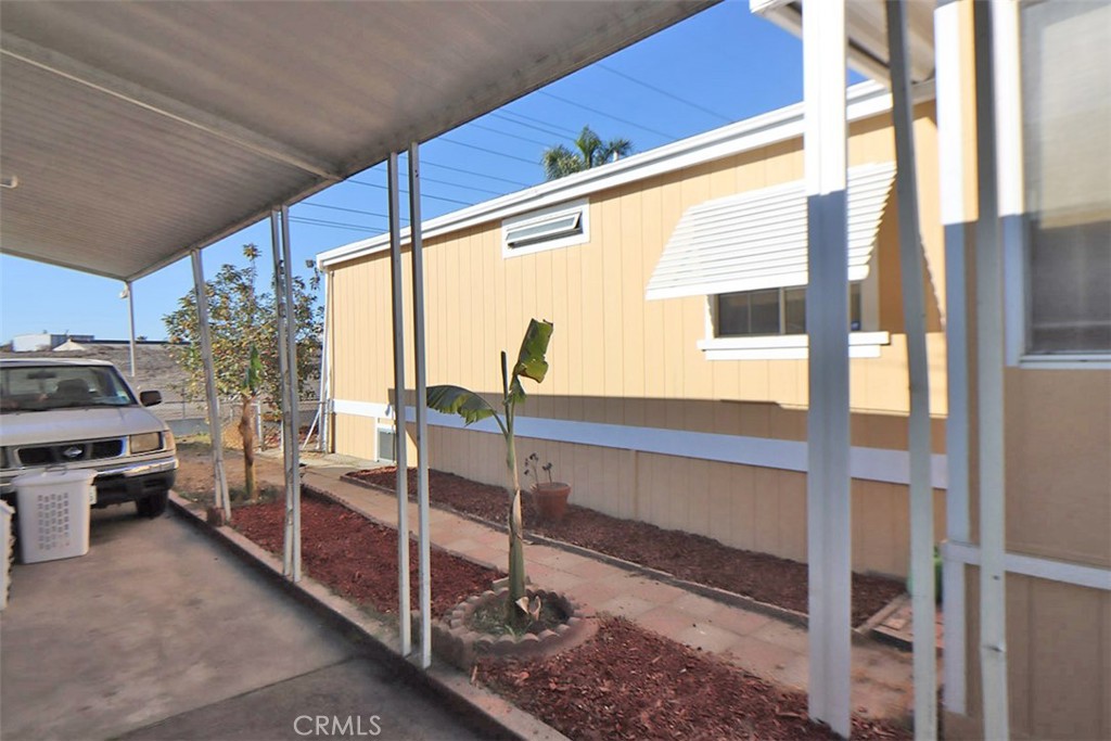 10001 West Frontage Road, Unit 64 South Gate, CA 90280 - Photo 23 of 35 a view of living room kitchen and floor to ceiling window