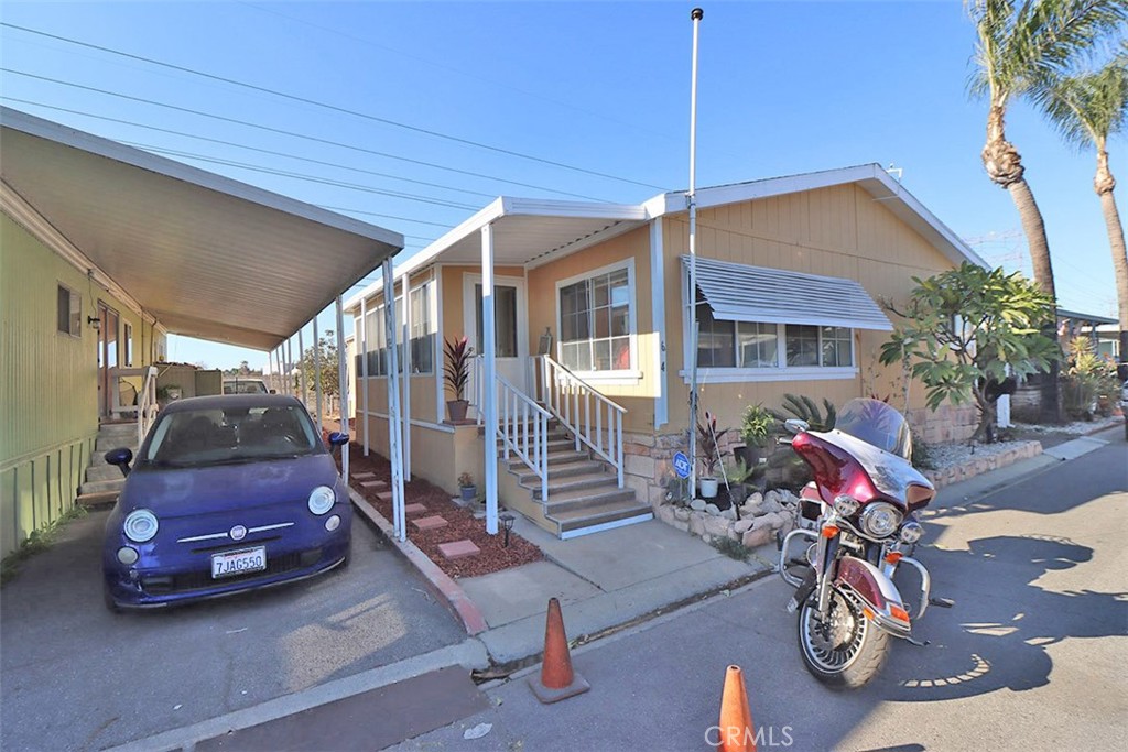 10001 West Frontage Road, Unit 64 South Gate, CA 90280 - Photo 30 of 35 a view of car parked in front of house