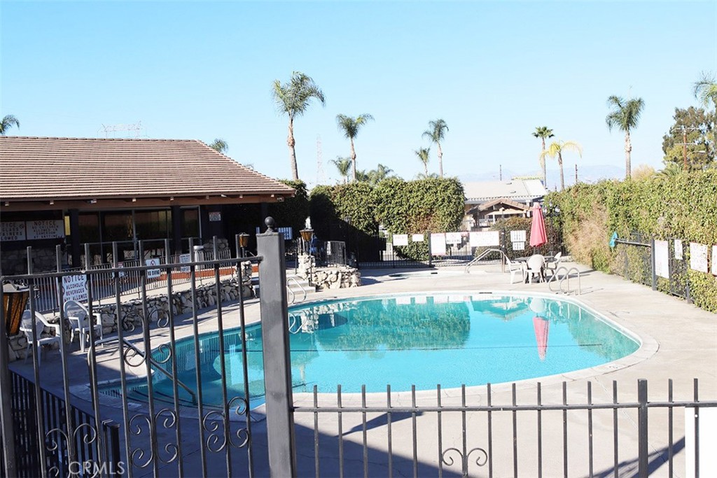 10001 West Frontage Road, Unit 64 South Gate, CA 90280 - Photo 33 of 35 a view of a house with swimming pool and sitting area