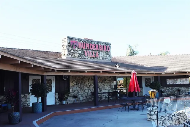 a view of a chairs and tables in patio