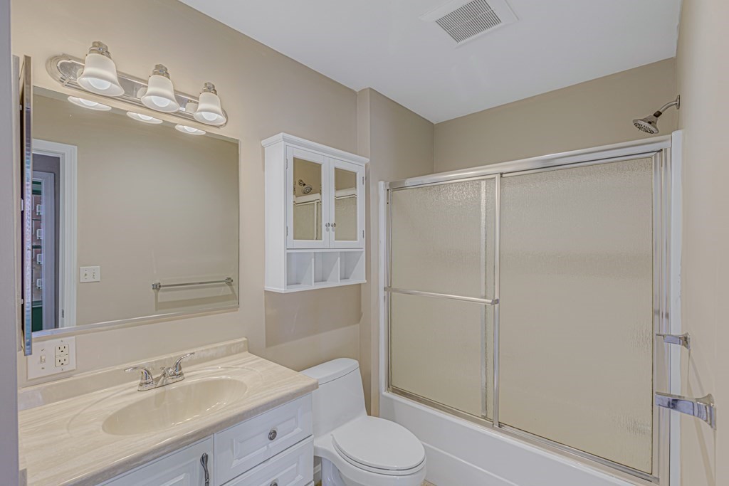 38 Village Road, Unit 305 Middleton, MA 01949 - Photo 11 of 25 a bathroom with a sink a toilet and shower