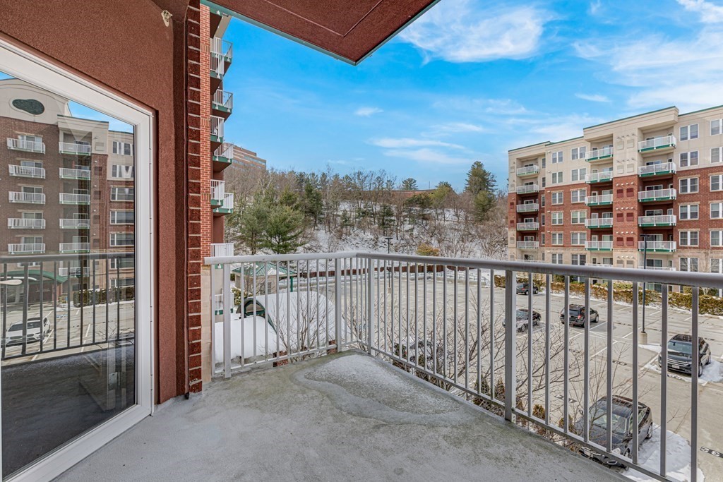 38 Village Road, Unit 305 Middleton, MA 01949 - Photo 14 of 25 a view of a balcony with city view