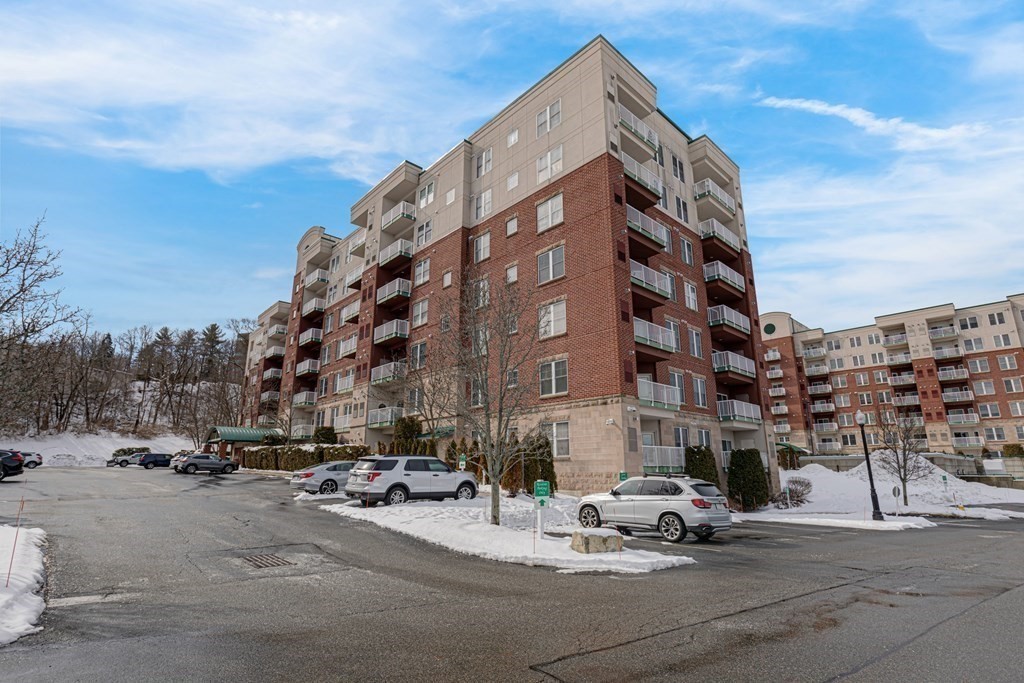38 Village Road, Unit 305 Middleton, MA 01949 - Photo 25 of 25 a view of a tall building