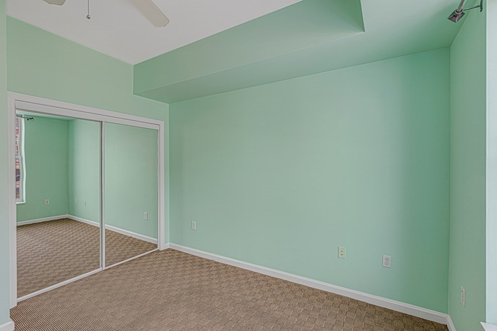 38 Village Road, Unit 305 Middleton, MA 01949 - Photo 9 of 25 an empty room with closet