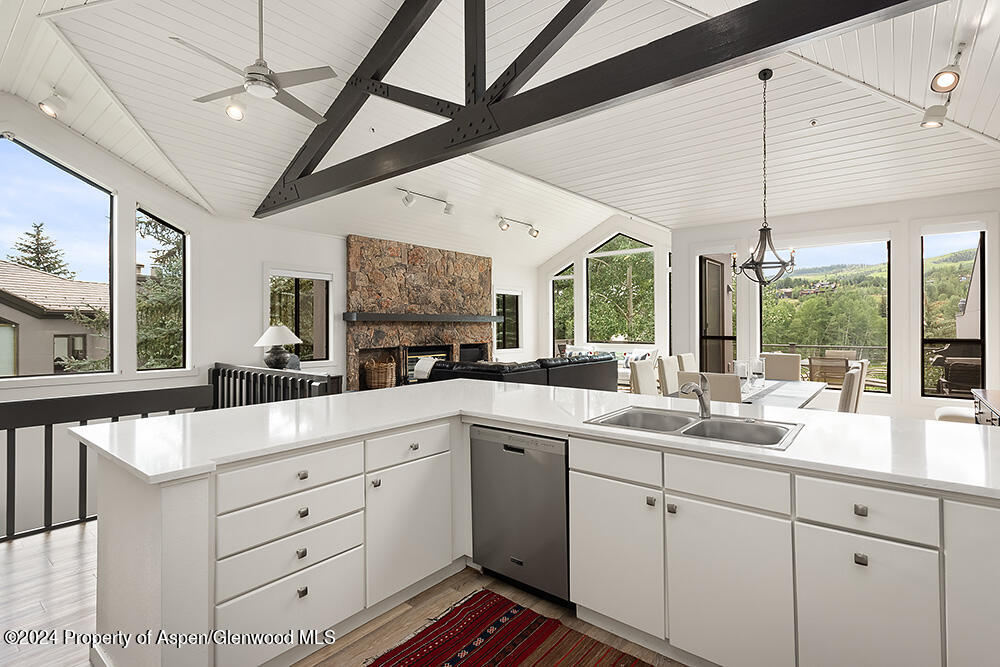 3904 Brush Creek Road, Unit 11 Snowmass Village, CO 81615 - Photo 13 of 25 a open kitchen with a sink window and cabinets