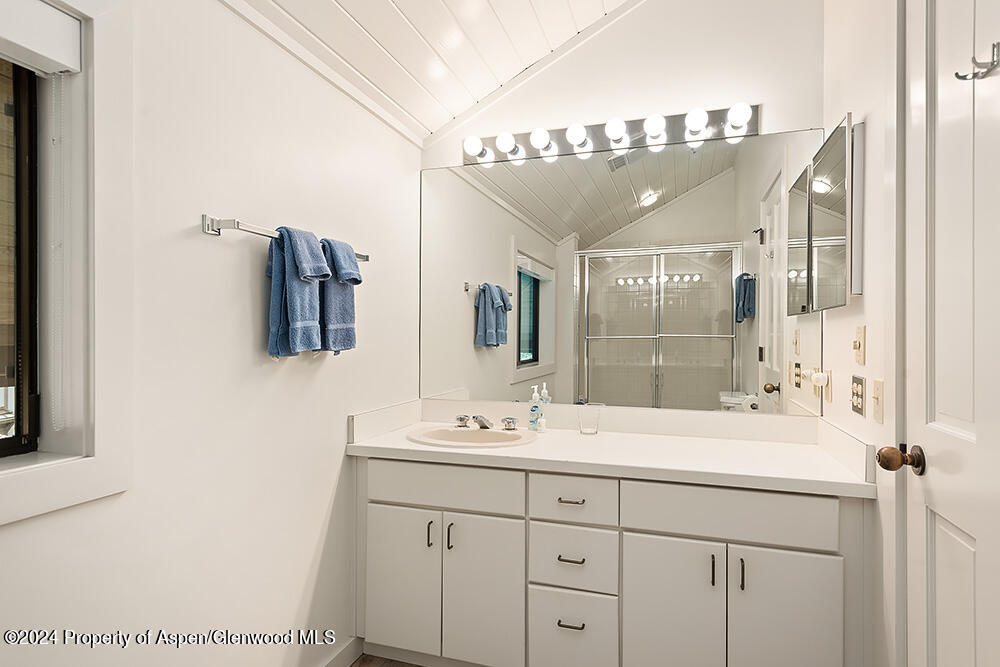 3904 Brush Creek Road, Unit 11 Snowmass Village, CO 81615 - Photo 19 of 25 a bathroom with a sink vanity and mirror