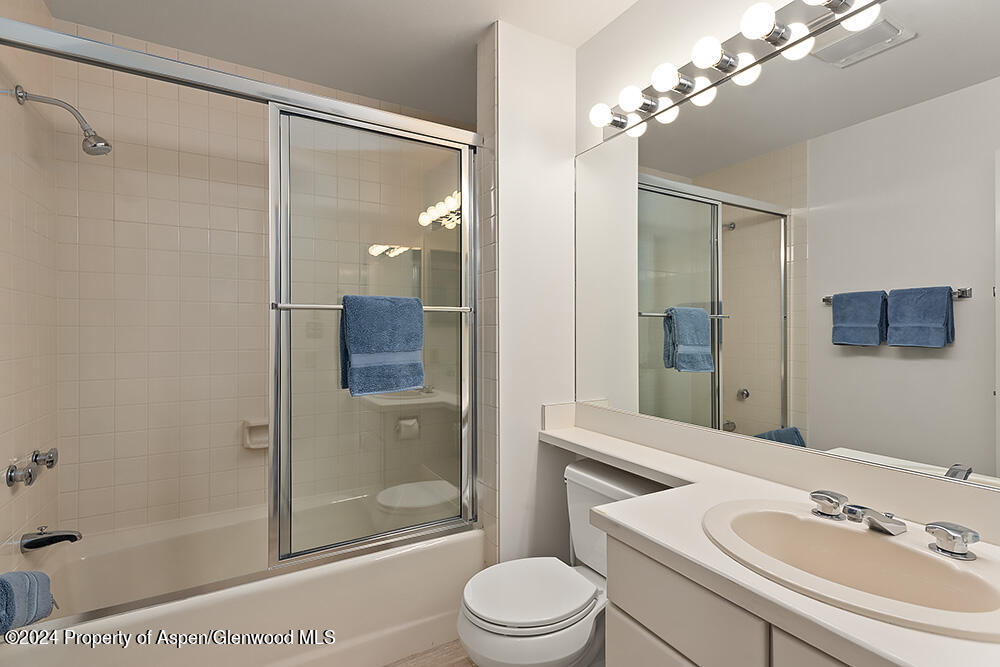 3904 Brush Creek Road, Unit 11 Snowmass Village, CO 81615 - Photo 21 of 25 a bathroom with a sink a toilet and shower