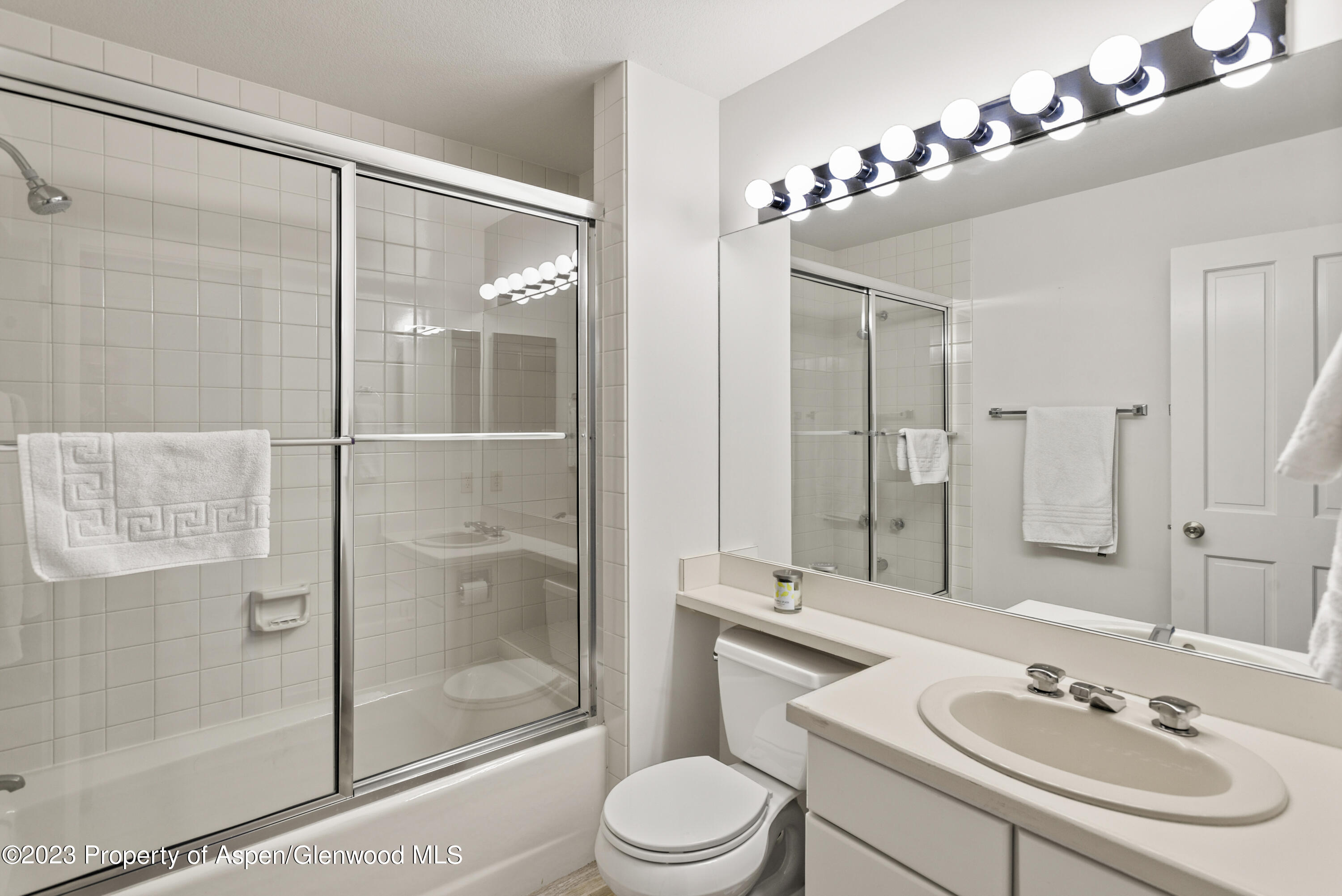 3904 Brush Creek Road, Unit 11 Snowmass Village, CO 81615 - Photo 23 of 25 a bathroom with a sink vanity granite toilet and shower