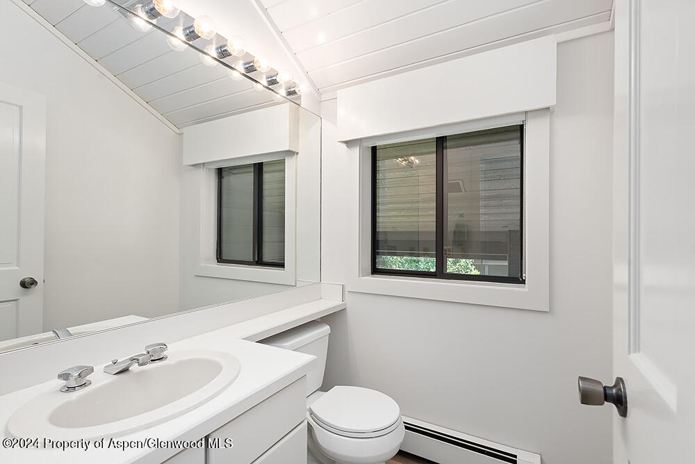 3904 Brush Creek Road, Unit 11 Snowmass Village, CO 81615 - Photo 24 of 25 a bathroom with a sink a toilet and a mirror
