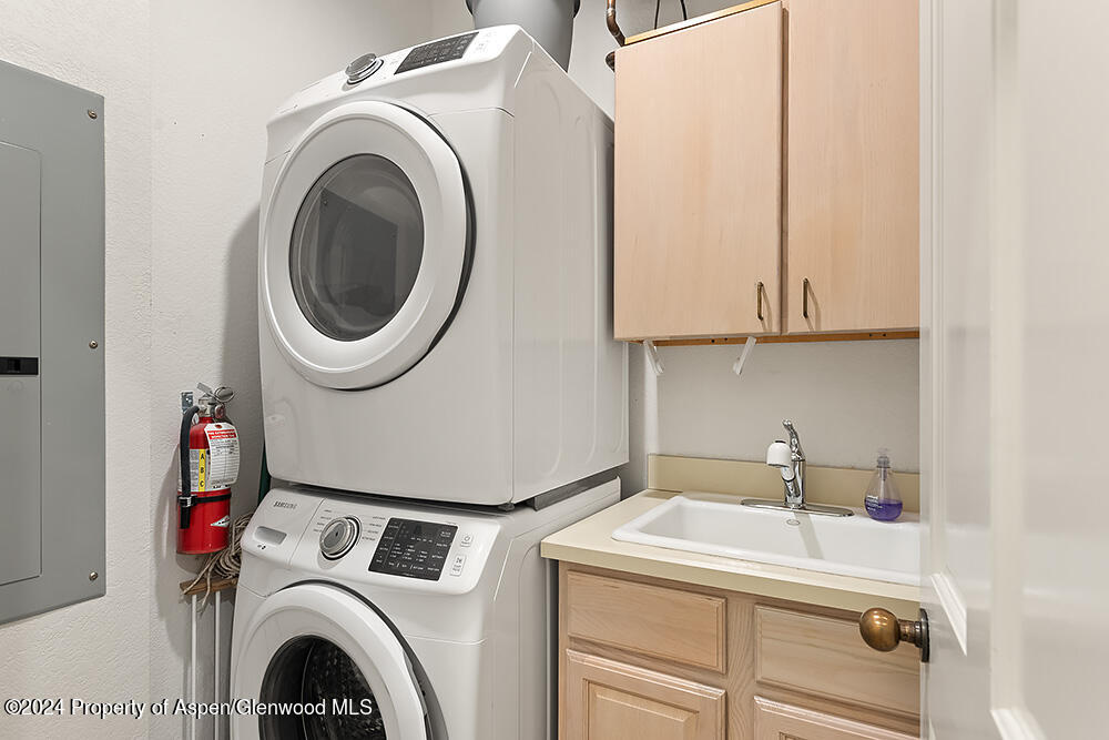 3904 Brush Creek Road, Unit 11 Snowmass Village, CO 81615 - Photo 25 of 25 a utility room with dryer and washer
