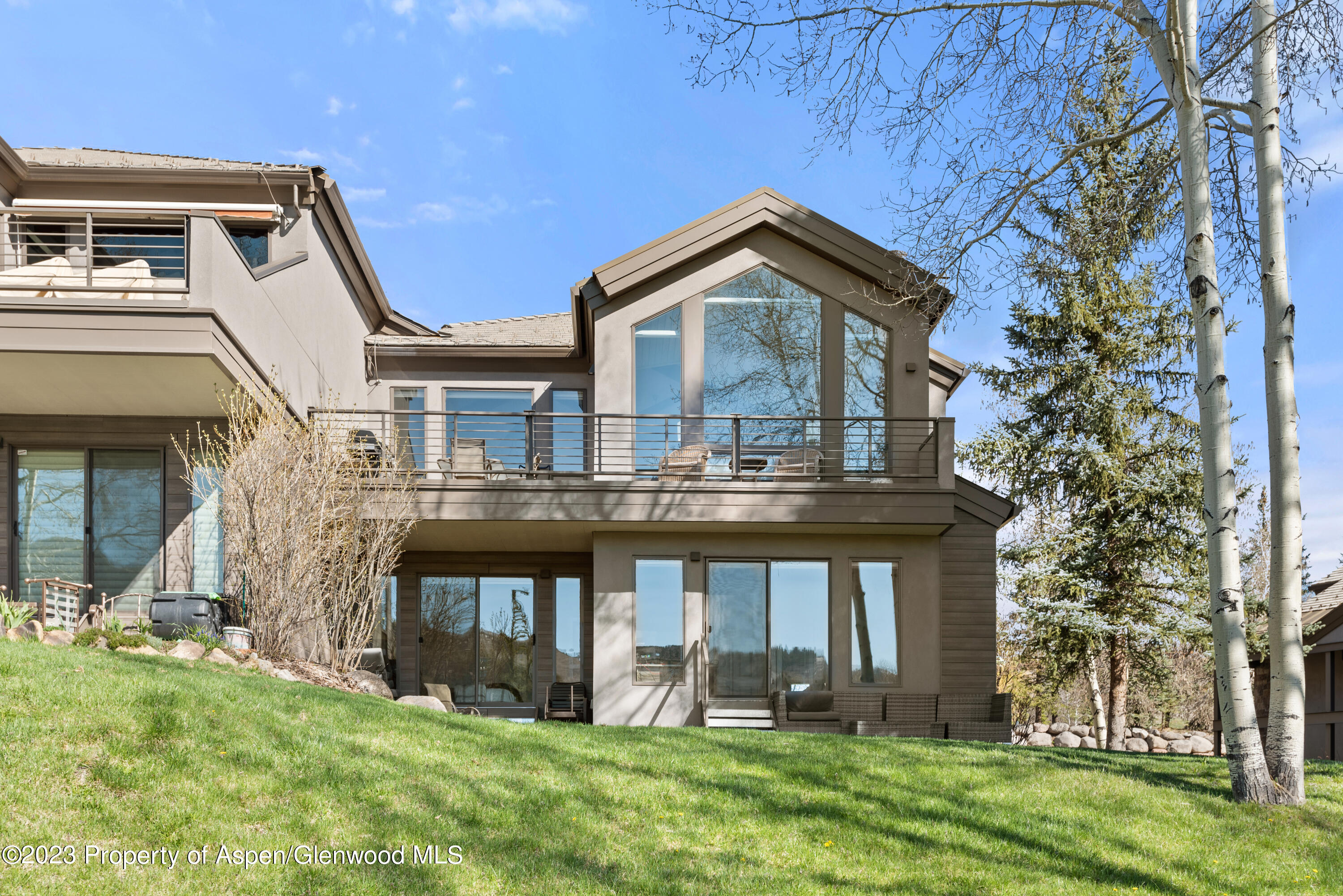 3904 Brush Creek Road, Unit 11 Snowmass Village, CO 81615 - Photo 3 of 25 front view of house with a yard