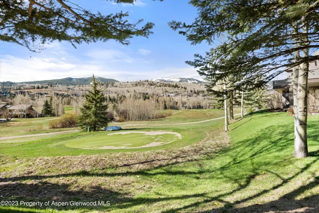 a view of a golf course with a lake