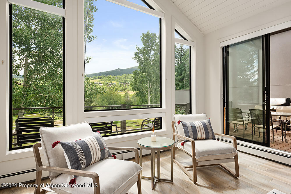 3904 Brush Creek Road, Unit 11 Snowmass Village, CO 81615 - Photo 8 of 25 a living room with furniture and a window