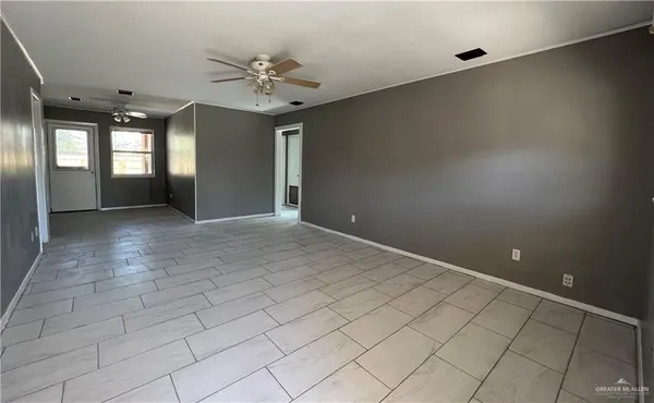 a view of an empty room with a window