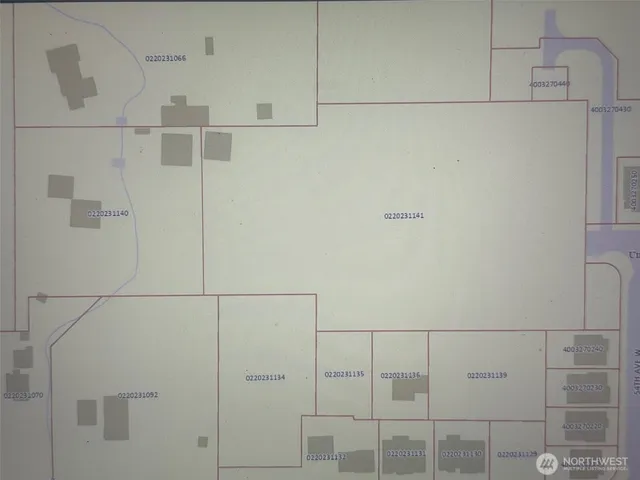 a small pool of water with a building in the background