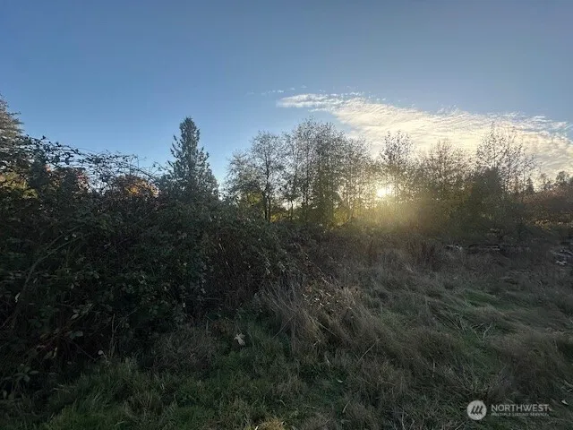 a view of a lake in between two of the house