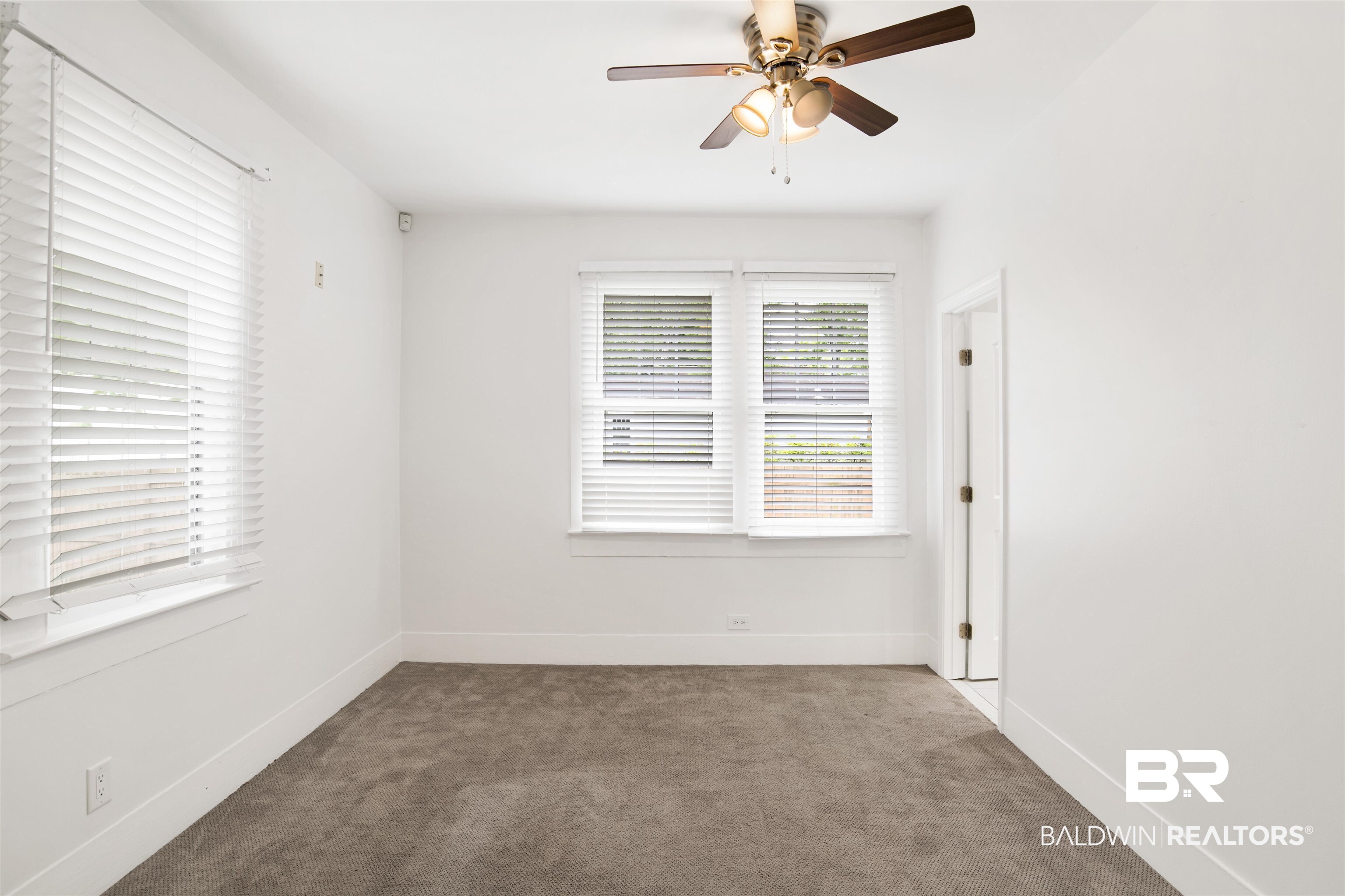 507 Holcombe Avenue Mobile, AL 36606 - Photo 15 of 28 Unfurnished room with carpet, ceiling fan, and baseboards