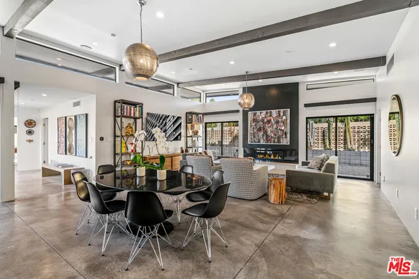 a kitchen with a sink a stove and a microwave