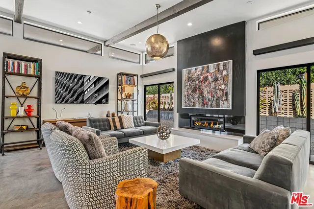 a spacious bedroom with a bed and a couch