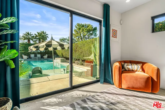 a living room with couches and a flat screen tv