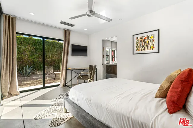a living room with fireplace furniture and a flat screen tv