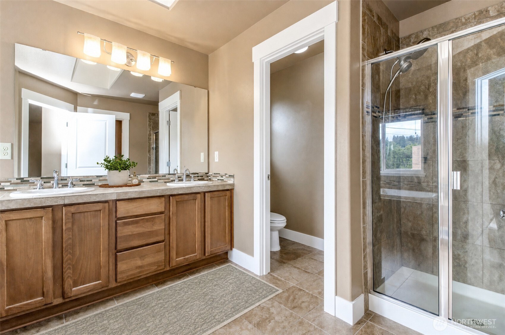 3000 South Mt Baker Boulevard Seattle, WA 98144 - Photo 24 of 40 a bathroom with a double vanity sink and a mirror