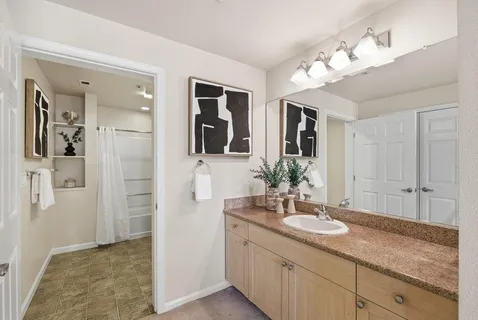 a bathroom with a shower and a toilet