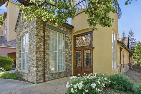 a front view of a house with swimming pool having outdoor seating