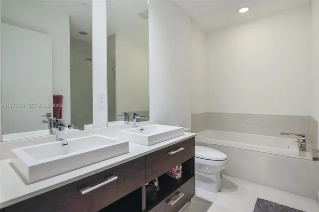 a bathroom with a sink a toilet and a bathtub