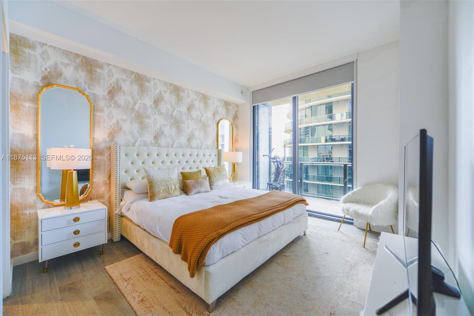 45 Southwest 9th Street, Unit 4108 Miami, FL 33130 - Photo 8 of 28 a bedroom with a bed chair and a window