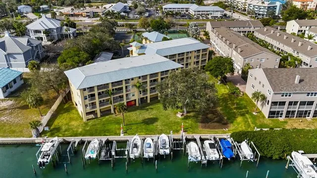 an aerial view of multiple houses with yard