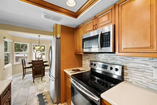 a kitchen with a stove and a microwave