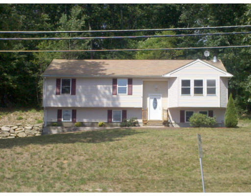 181 Gore Road Webster, MA 01570 - Photo 1 of 1 a front view of a house with a yard