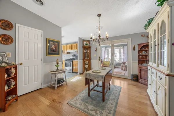 a view of a livingroom with furniture window and wooden floor