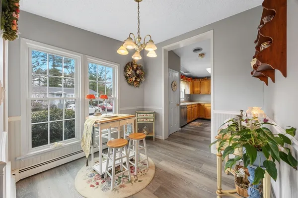 a view of a dining room with furniture window and wooden floor