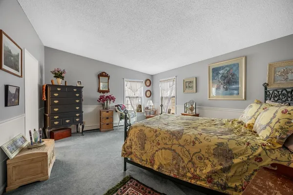 a bed room with a bed and furniture