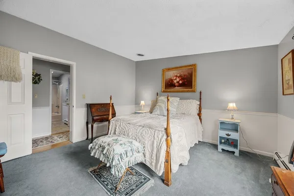 a bedroom with bed and a window