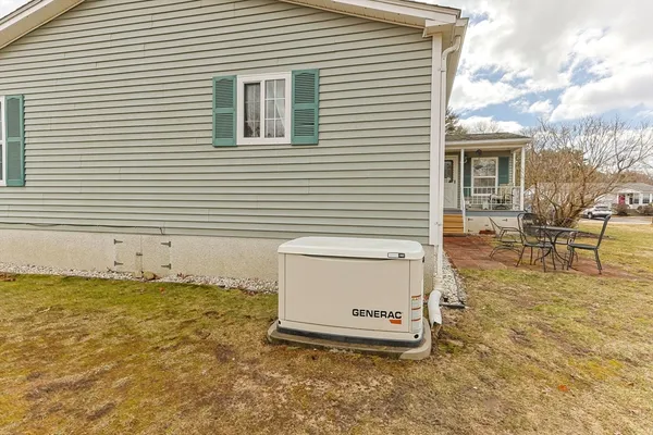 a view of a patio with table and chairs and wooden floor