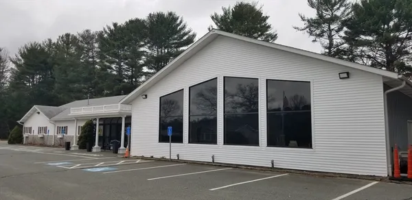 a view of a white house with a large windows