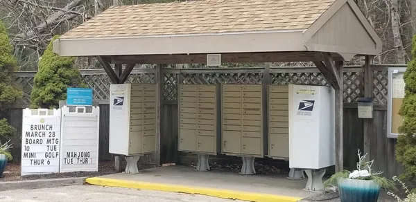 a front view of a house with sitting area
