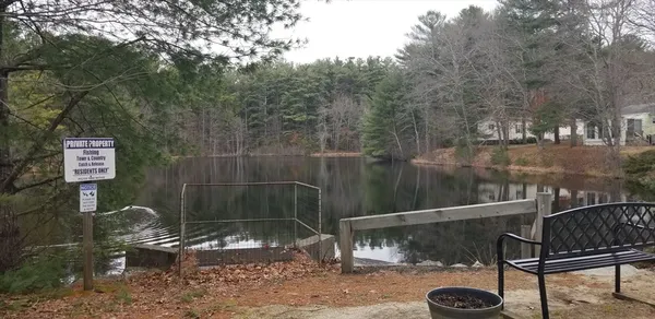 a view of a bench in a backyard
