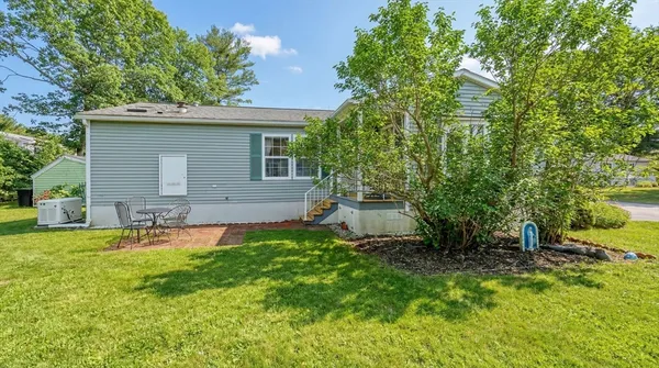 a backyard of a house with seating space
