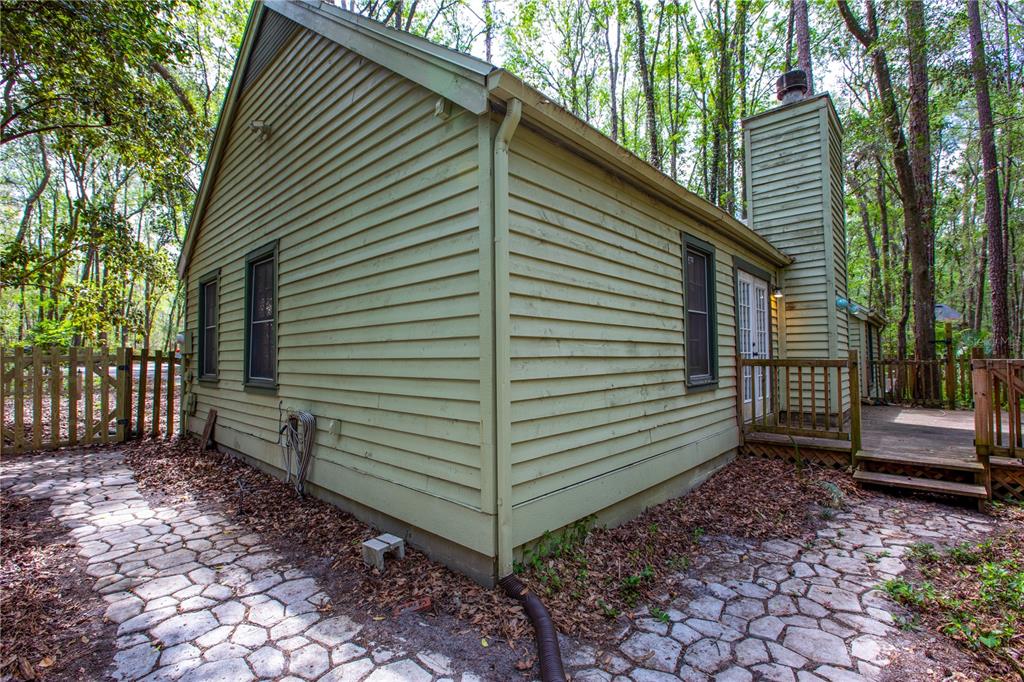 5208 Southwest 86 Terrace Gainesville, FL 32608 - Photo 25 of 26 a view of a house with a yard and furniture