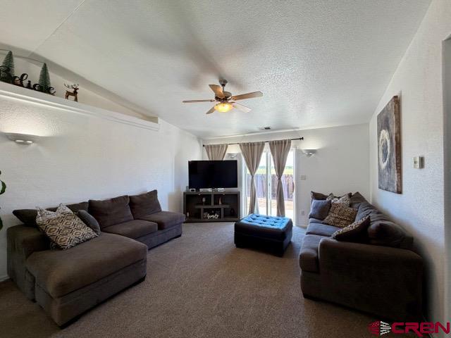 544 20th Street Delta, CO 81416 - Photo 15 of 44 a living room with furniture and a flat screen tv