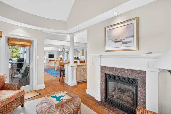 a living room with furniture fireplace and a flat screen tv