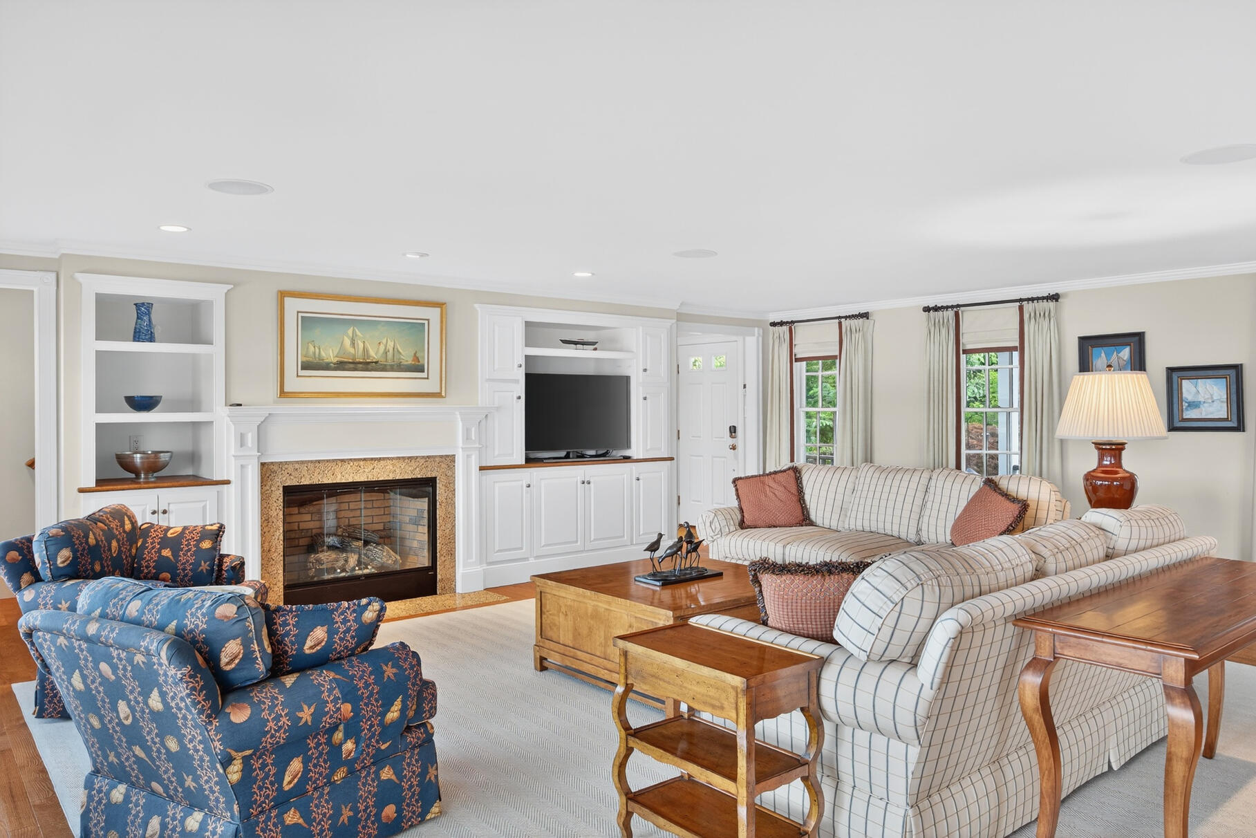 10 Brian Way Harwich, MA 02645 - Photo 20 of 75 a living room with furniture a flat screen tv and a fireplace