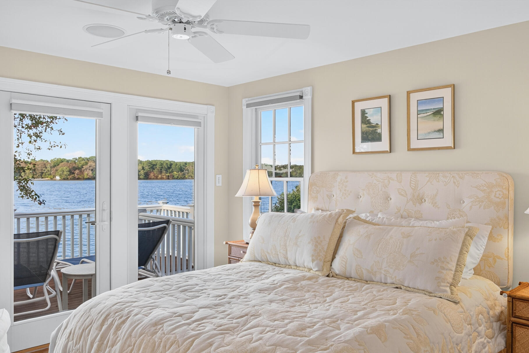 10 Brian Way Harwich, MA 02645 - Photo 27 of 75 a bedroom with a large bed and a chandelier